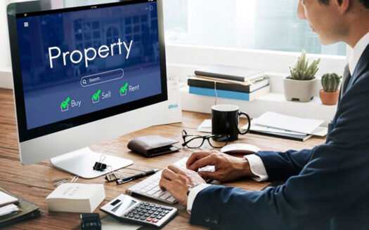 a man working on a desktop for property management